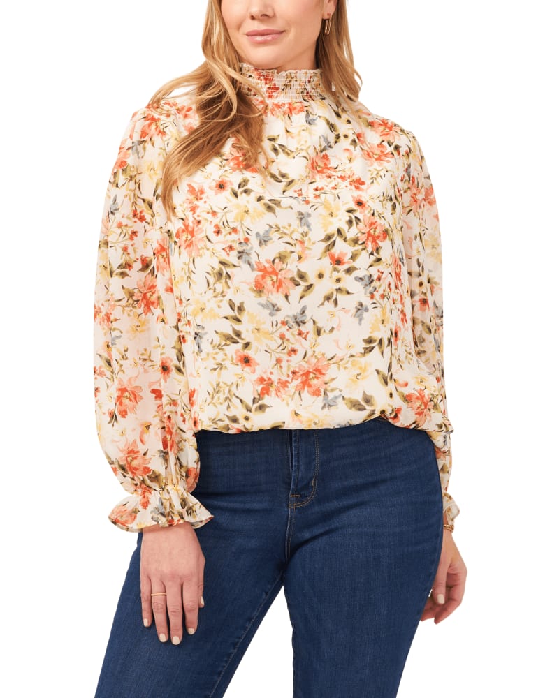 Front of a model wearing a size 0X Lucille Smock Neck Blouse in DAYBRK WTRCLR by 1.State. | dia_product_style_image_id:262587